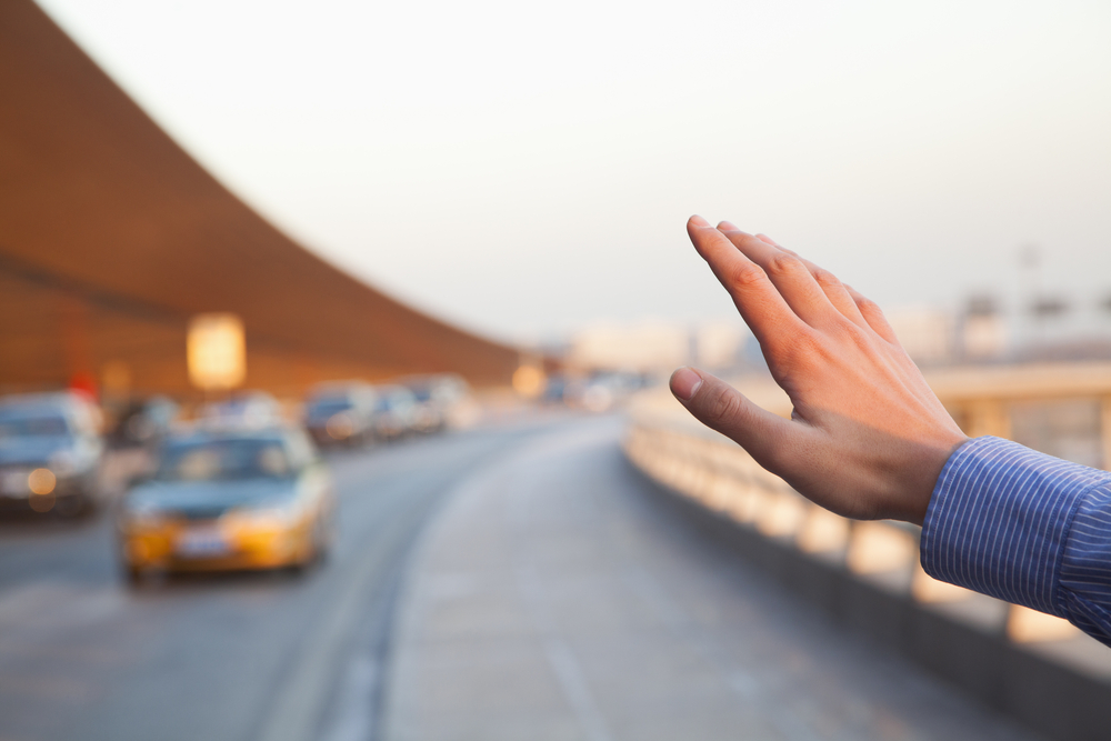 traveler-hailing-taxi
